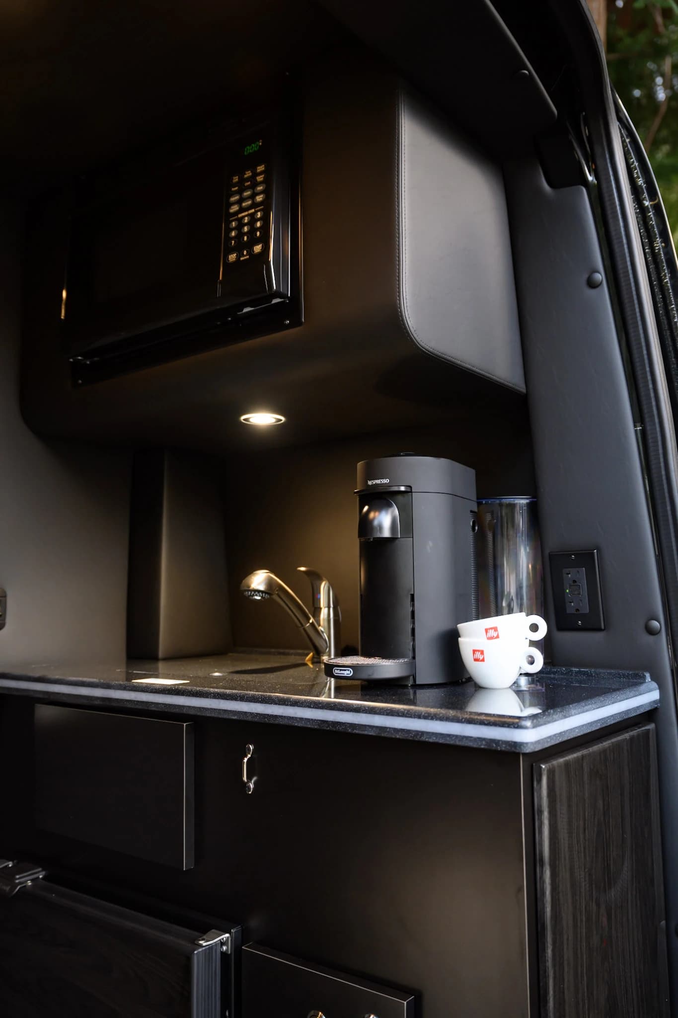 Enjoy freshly brewed Nespresso coffee and chilled beverages from our onboard beverage station — a signature touch on every MIOR luxury Sprinter ride.