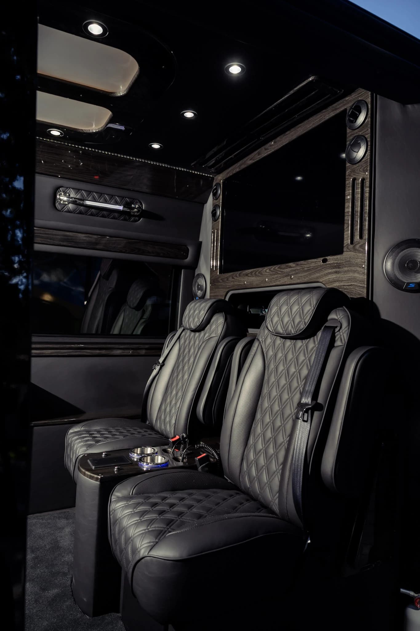 Sink into handcrafted quilted leather captain's chairs with individual armrests, designed for maximum comfort on Napa Valley tours and Bay Area transfers.